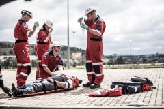 ER24 File - paramedics working with patient near wrecked car 1