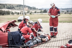 ER24 File - paramedics working with patient near wrecked car (1)