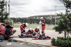 ER24 File - paramedics working with patient near wrecked car 2